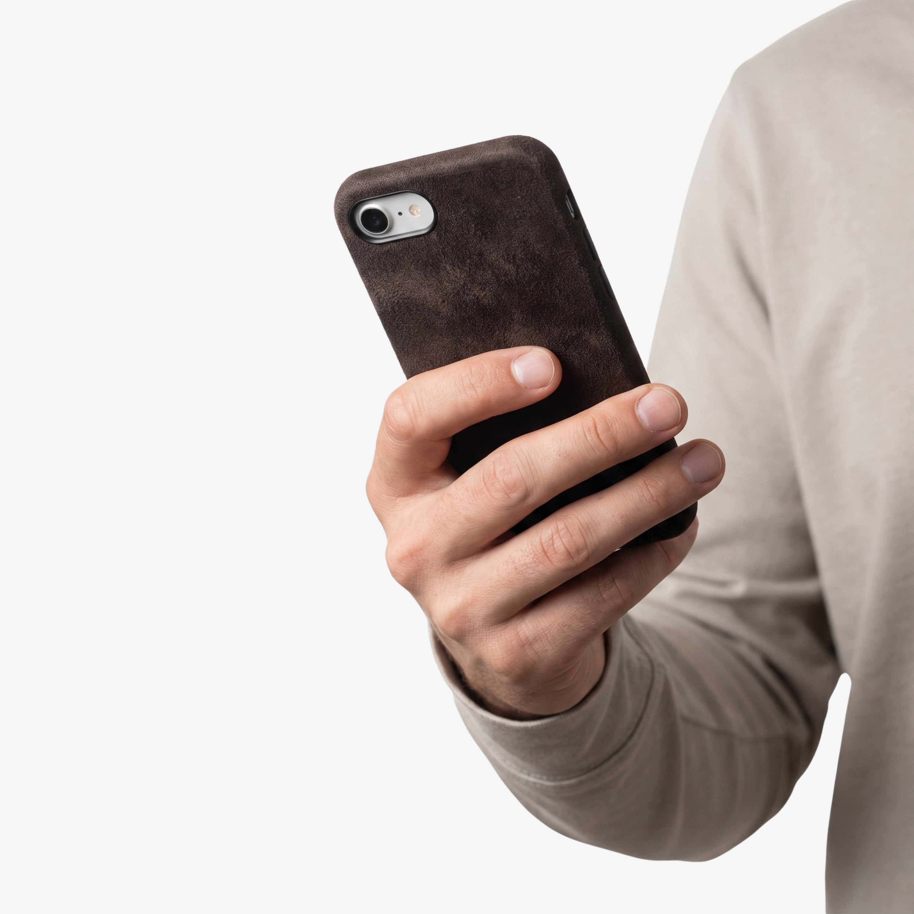 iPhone 16e Chocolate Brown Alcantara® Case held in hand