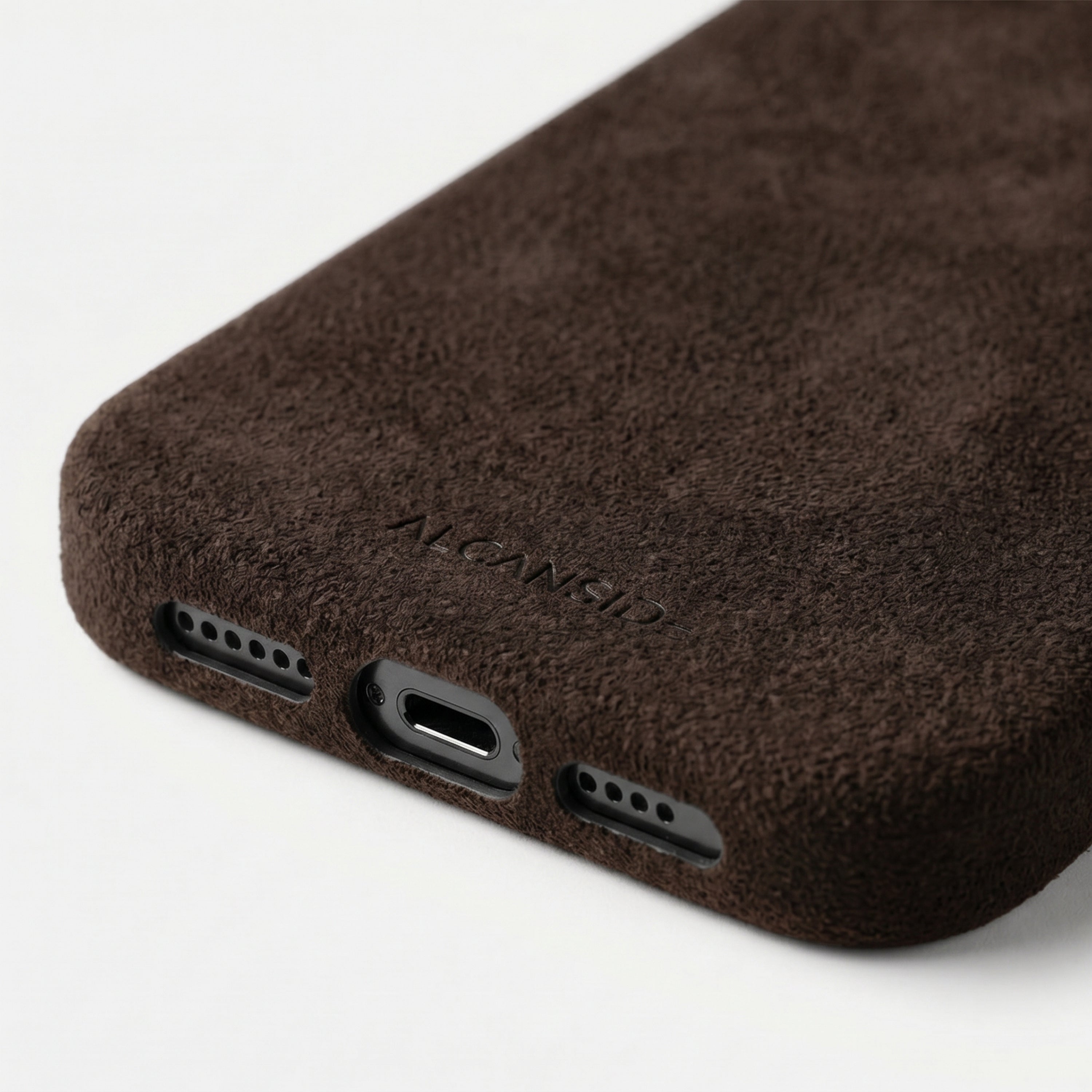 iPhone 17e Chocolate Brown Alcantara® Case – bottom detail with ALCANSIDE emboss